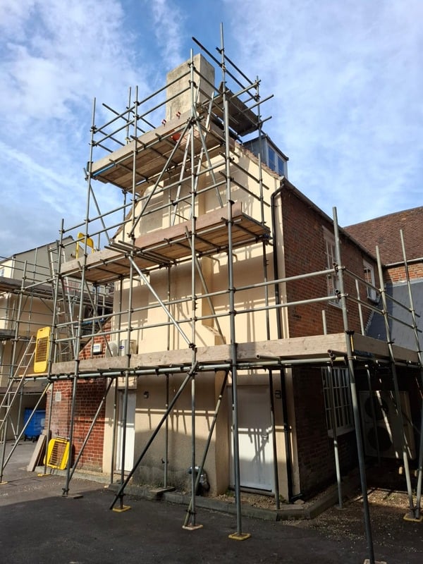 SCAFFOLDING PREPARED FOR DECORATING TO A COMMERCIAL BUILDING